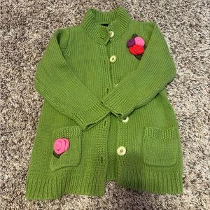 Girls like new green mock neck button up sweater.